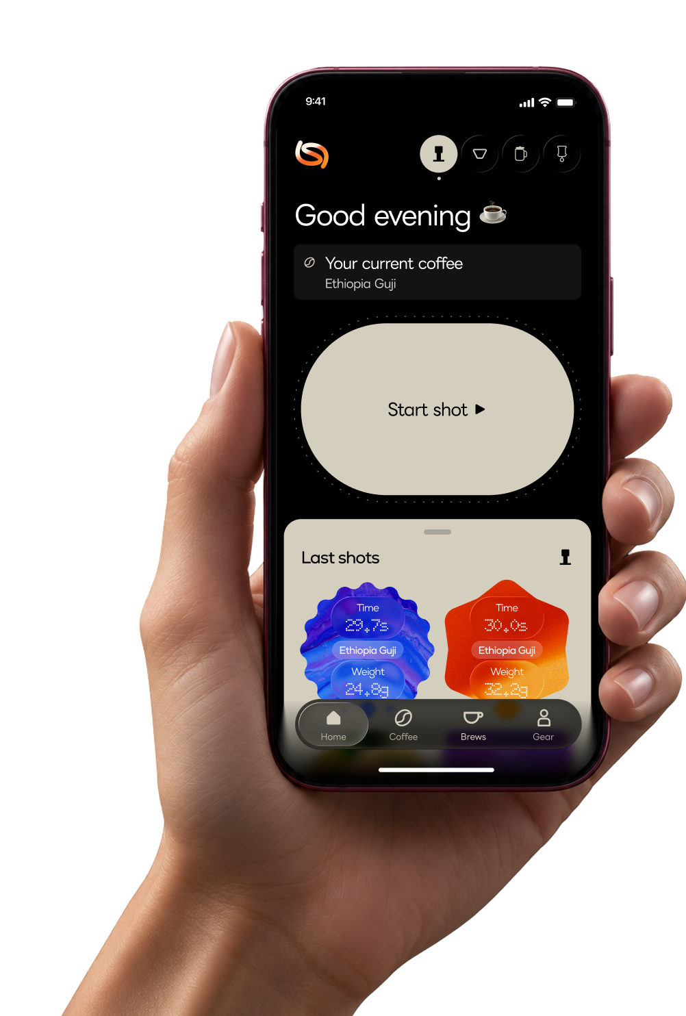 A hand holding a phone with the Shot home screen.